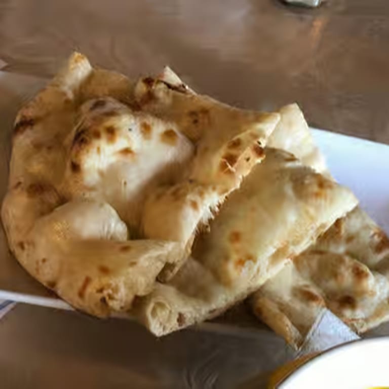 Freshly Baked Naan: A Flavorful Addition